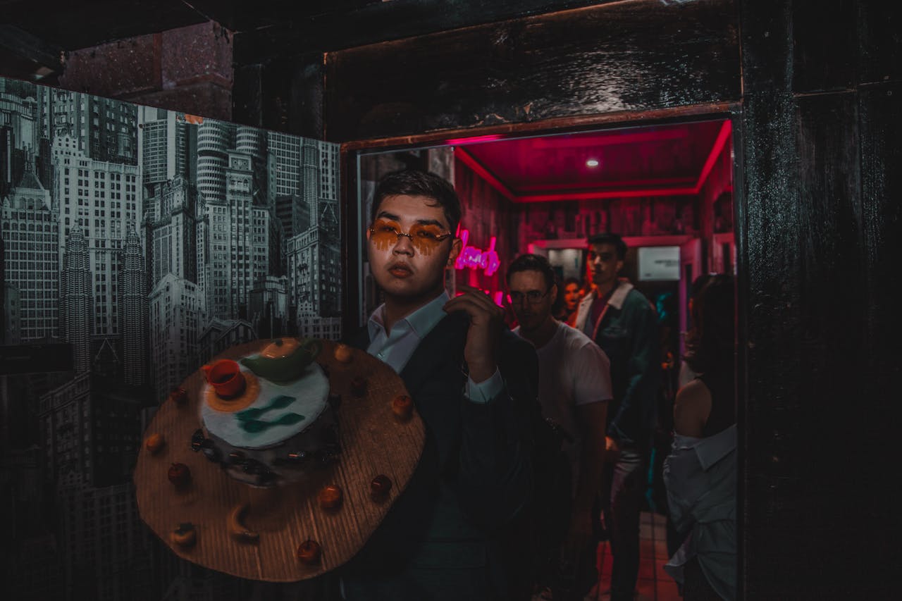 Home Stylish individuals enjoying a vibrant nightlife scene at a party.